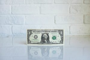 Artful photo of dollar standing on edge